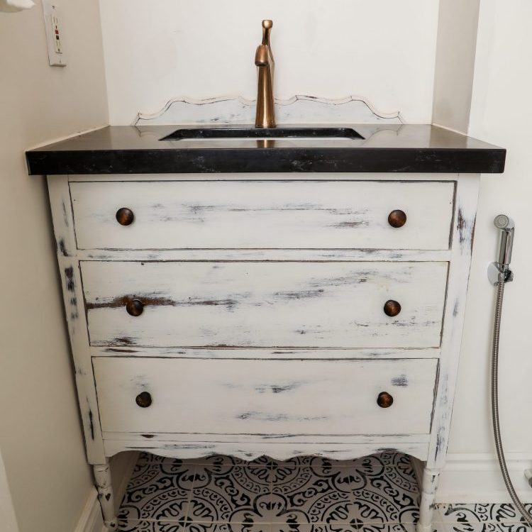 Bathroom vanity in white, black countertop